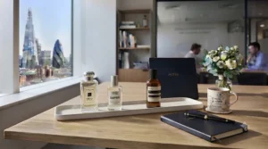 Demonstration of how to apply office perfume lightly to pulse points to avoid over-scenting in shared workspaces.