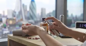 Demonstrating the correct application of a discreet unisex office fragrance on pulse points.