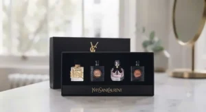 A luxury YSL perfume gift set for ladies, containing a selection of miniature fragrance bottles in a classic black and gold box.