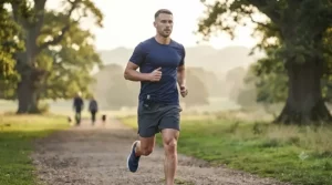 Runner checking a pocket-friendly travel size sport fragrance during an outdoor morning jog.